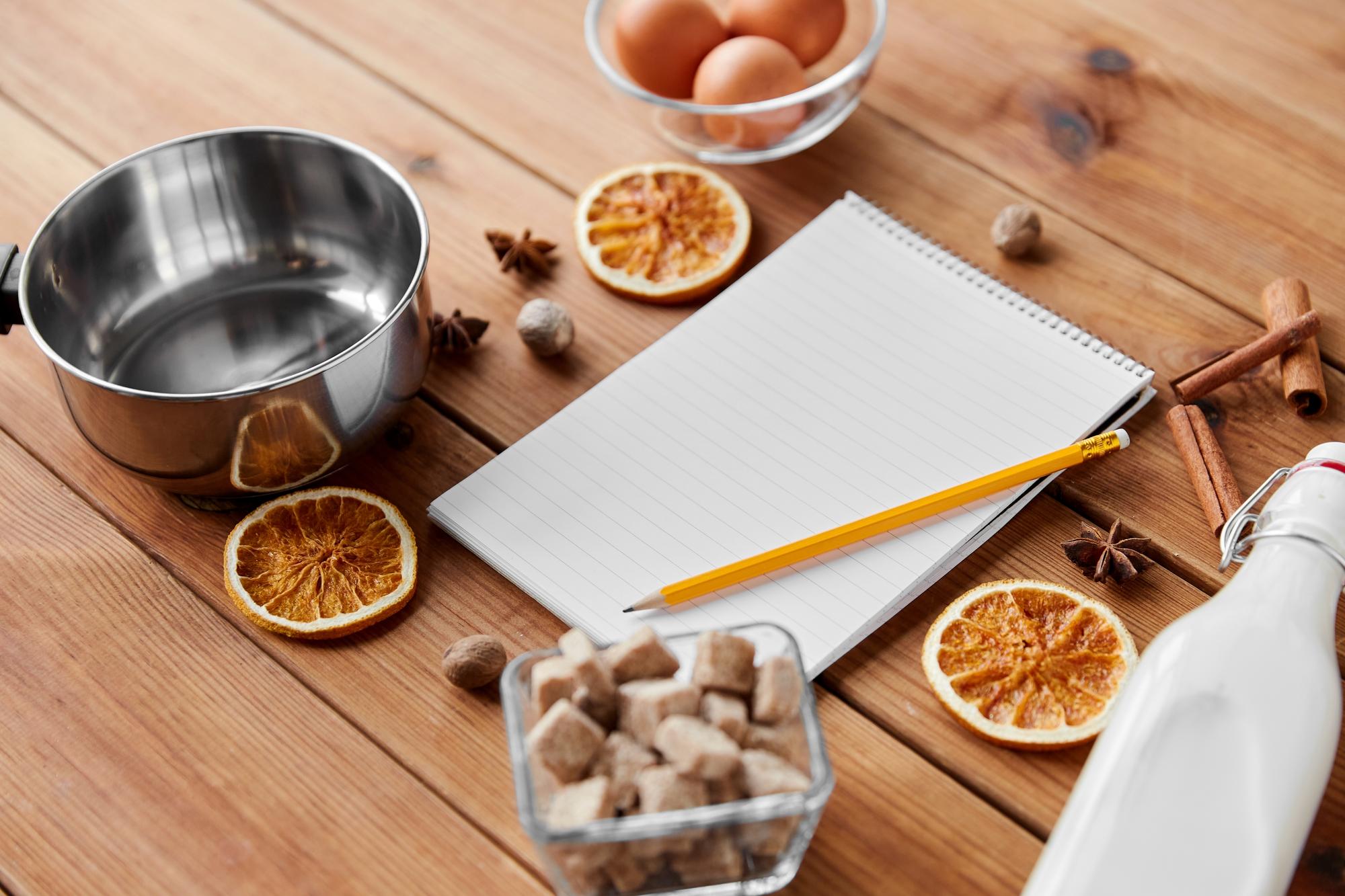 small kitchen workspace with ingredients and notebook